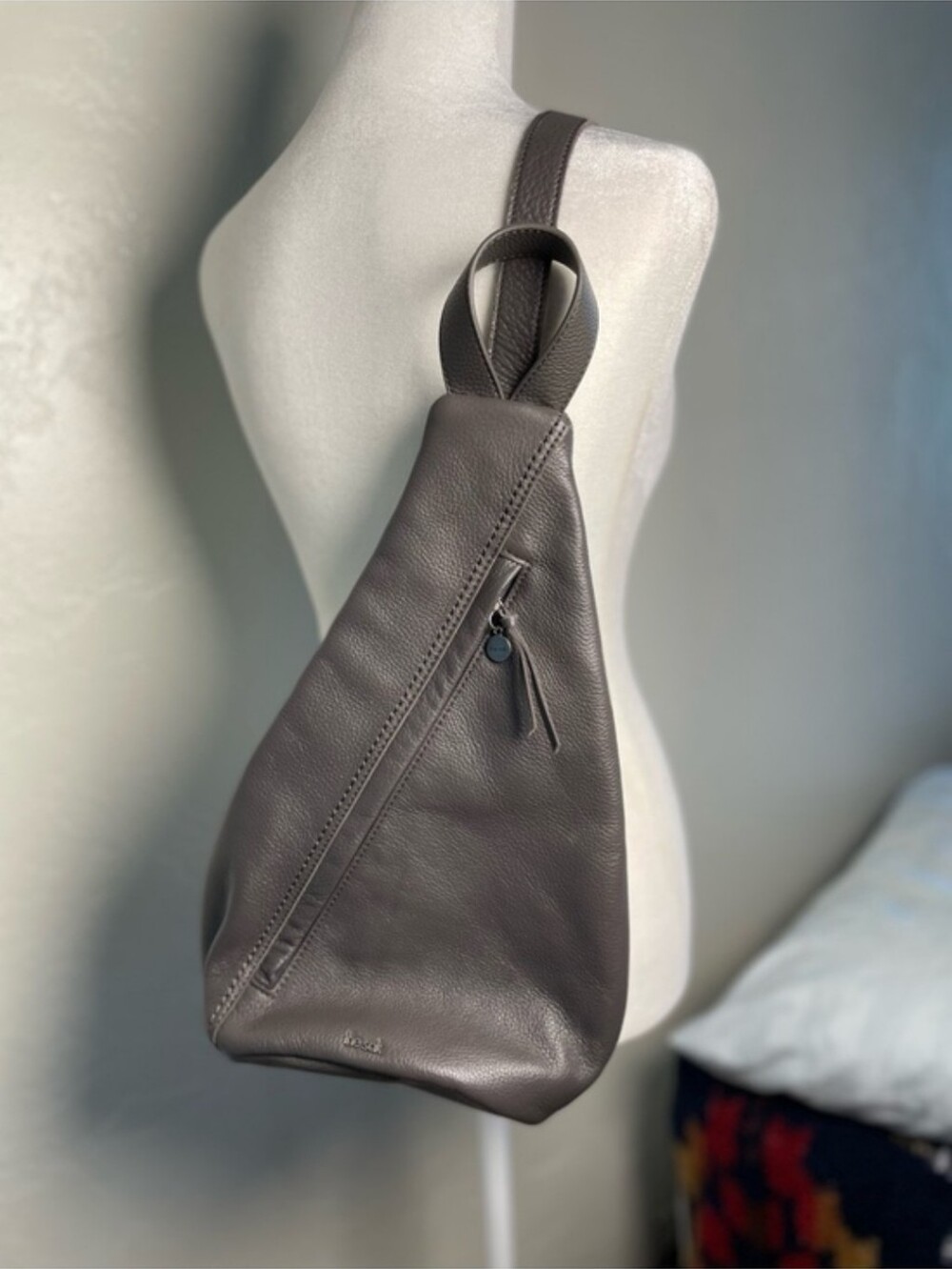 The SaK gray Sling Backpack